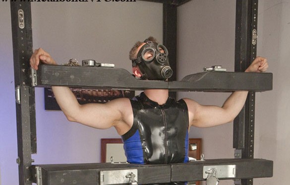 A ruber stud visits Serious Male Bondage and gets locked in vertical stocks