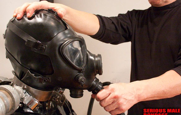 Rubber, steel bondage and a gas mask