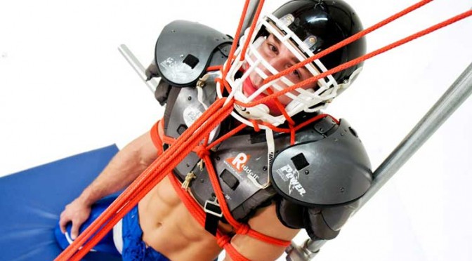 Bound muscle jock Marc Dylan is tied up in his football uniform