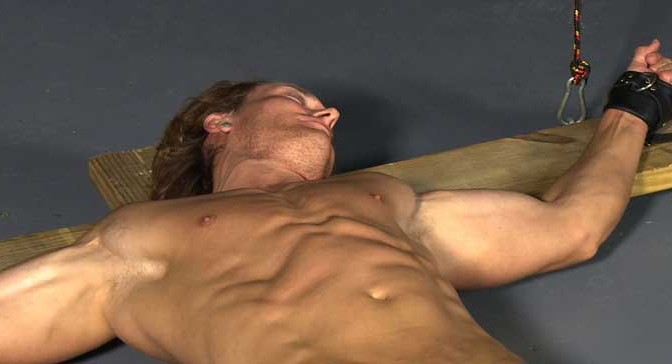 Video: Blond muscle stud Chris is crucified, his magnificent body stretched and tortured for eight hours on the cross