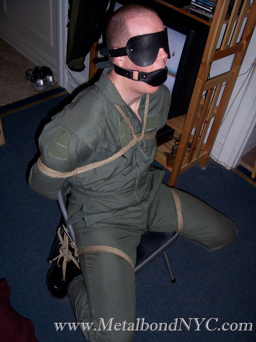 tied in a chair in paratroope boots and gagged