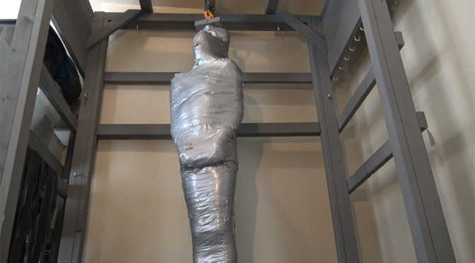Vertical duct tape mummification