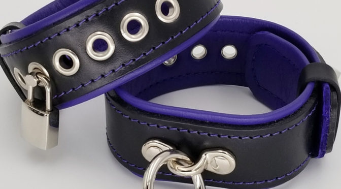Bondage gear: Purple leather-lined restraints
