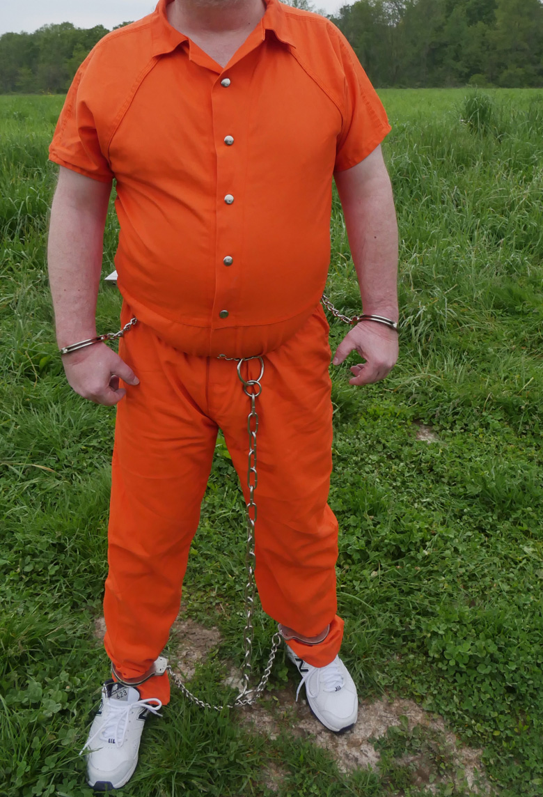 male bondage inmate in prisoner jumpsuit
