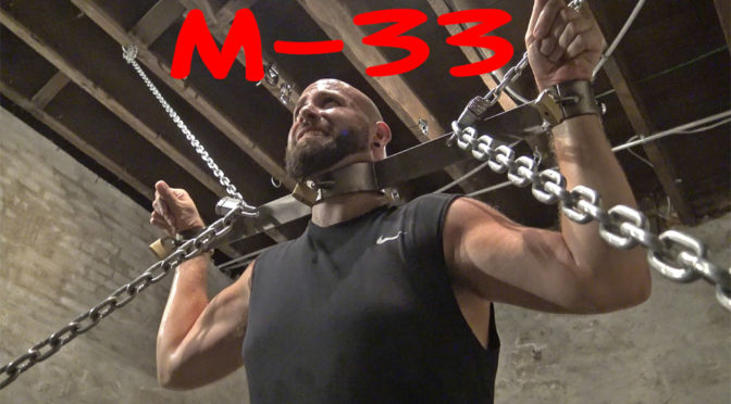 muscular prisoner in bondage