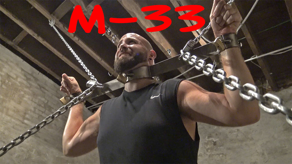 muscular prisoner in bondage