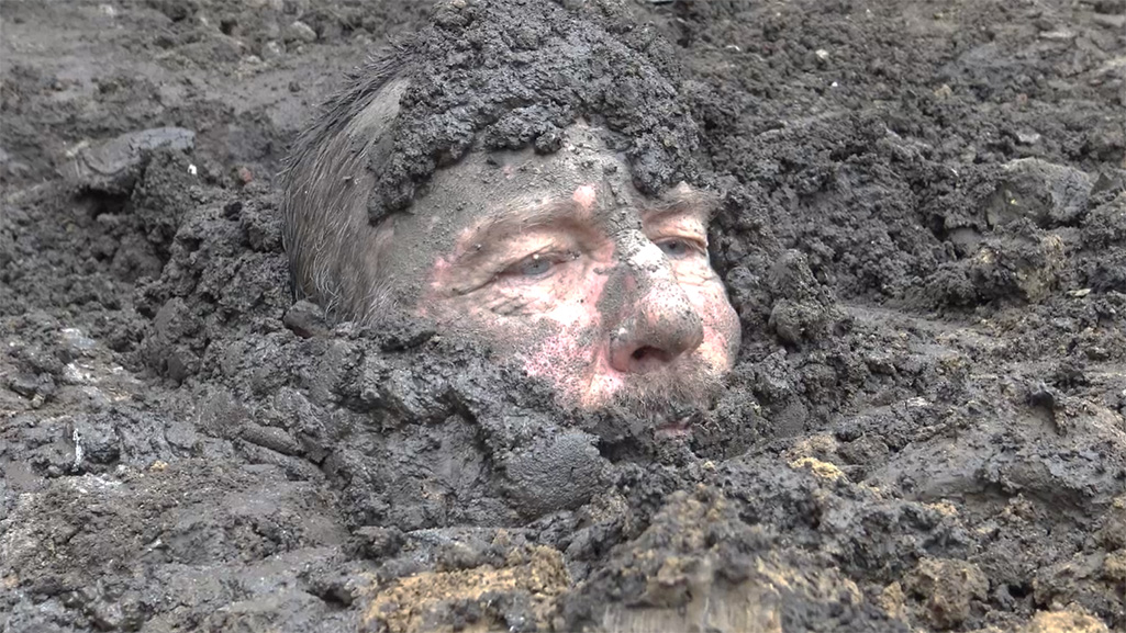 prisoner buried in the mud for bondage torture