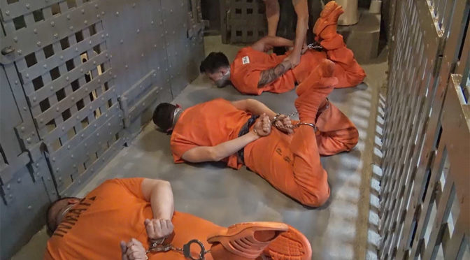 Three prisoners get hog-chained in the cellblock