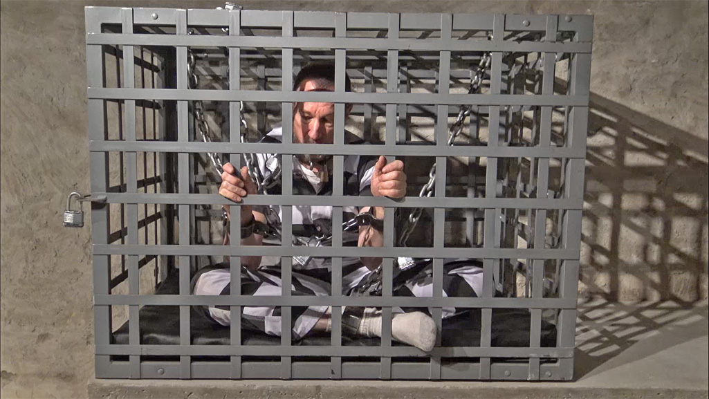 men in cages