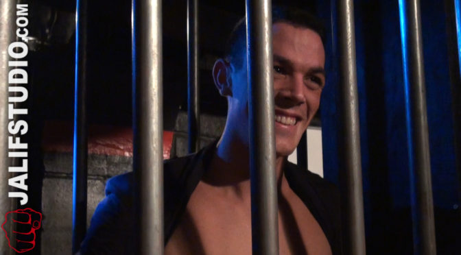 Male-on-male sex through the bars of a large cage