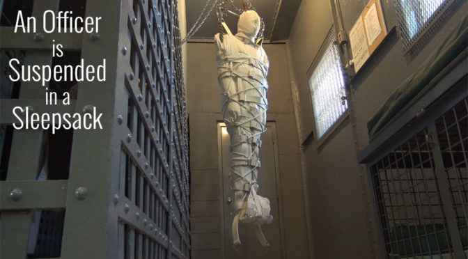 An officer is suspended in a sleepsack