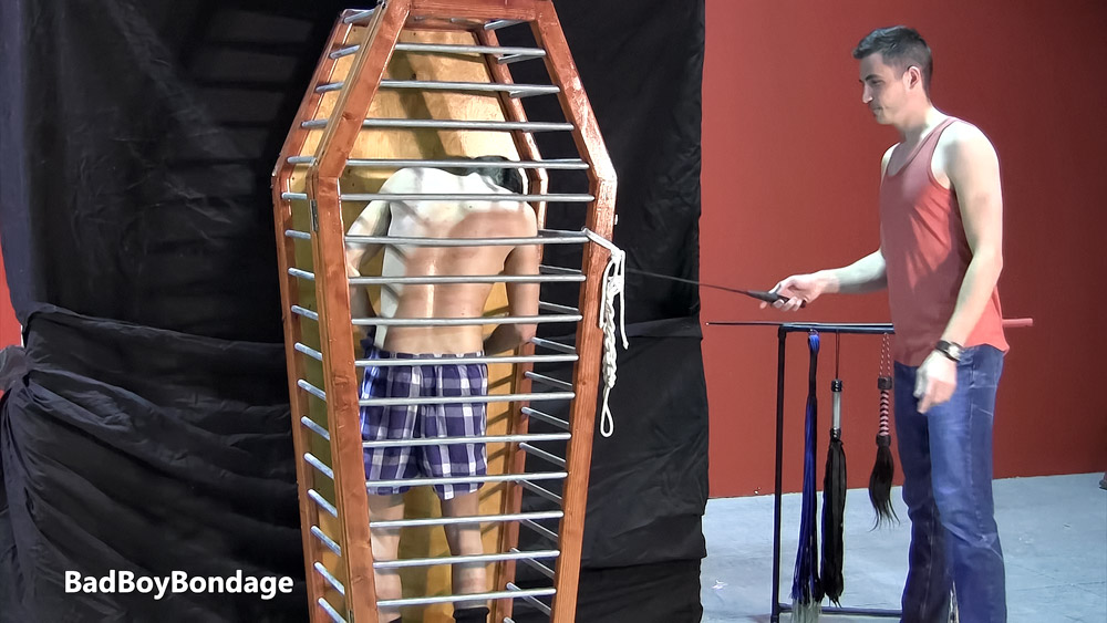 Trapped in the cage at Bad Boy Bondage