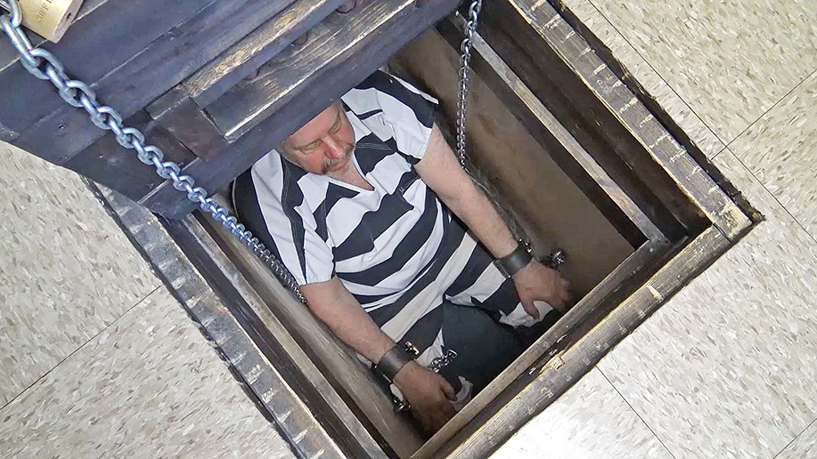 A Prisoner Gets Chained in a Pit