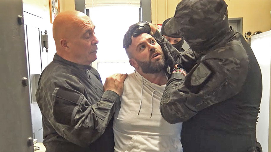 a prisoner is roughed up by officers