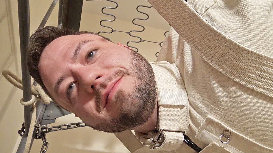 Two men creatively bound in canvas and leather